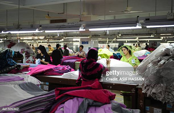 To go with AFP story Pakistan-labour-commerce-textile-accident,FEATURE by Guillaume Lavallee In this photograph taken on November 11 Pakistani...