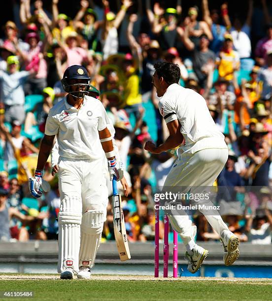 Michael Starc of Australia reacts after taking the wicket of Murali Vijay of India during day two of the Fourth Test match between Australia and...