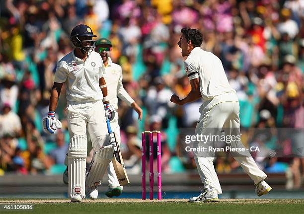 Mitchell Starc of Australia celebrates after taking the wicket of Murali Vijay of India during day two of the Fourth Test match between Australia and...