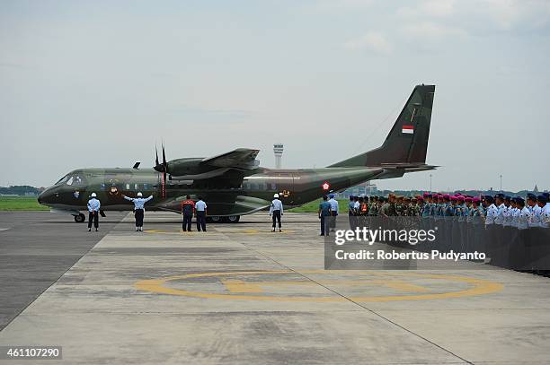 Indonesian military soldiers standby for the arrival of coffins containing the victims of the AirAsia flight QZ8501 disaster at Juanda Military Base...