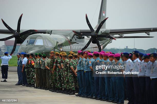 Indonesian military soldiers standby for the arrival of coffins containing the victims of the AirAsia flight QZ8501 disaster at Juanda Military Base...