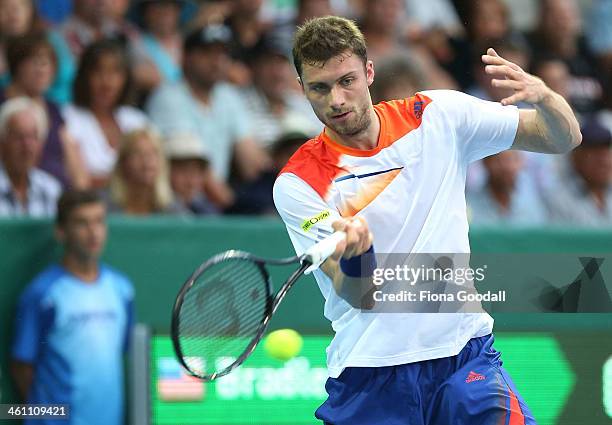 Daniel Brands of Germany hits a shot against Bradley Klahn of USA before rain interrupted play in the second set during day two of the Heineken Open...