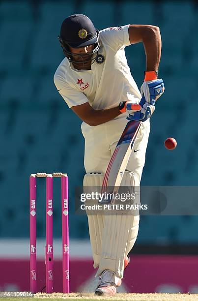 India's batsman Karn Sharma bats during day two of the fourth cricket Test between Australia and India at the Sydney Cricket Ground on January 7,...