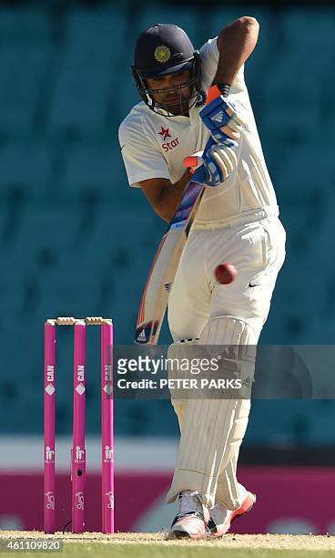 India's batsman Karn Sharma bats during day two of the fourth cricket Test between Australia and India at the Sydney Cricket Ground on January 7,...