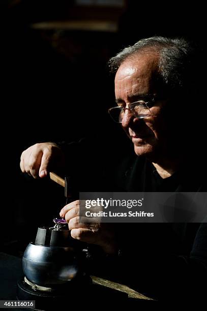 January 28: A Ganaelle jewelry craftsman works on a ring to make a jewel at his workstation at a Ganaelle Jewelry workshop on January 28, 2011 in...