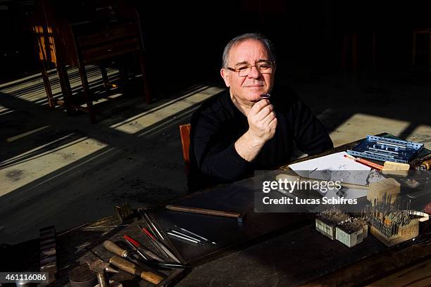 January 28: A Ganaelle jewelry craftsman works on a ring to make a jewel at his workstation at a Ganaelle Jewelry workshop on January 28, 2011 in...