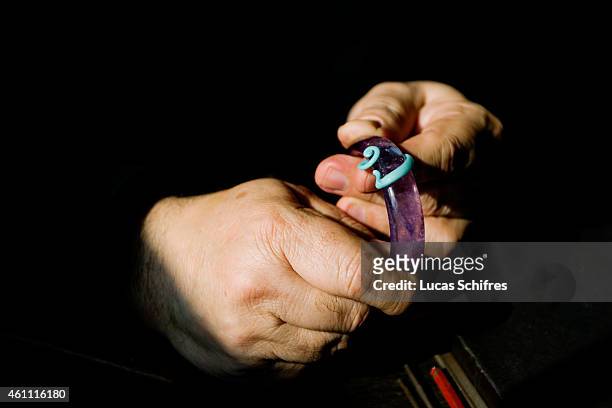 January 28: A Ganaelle jewelry craftsman works on a bracelet to make a jewel at his workstation at a Ganaelle Jewelry workshop on January 28, 2011 in...