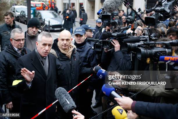 Francois Molins, Paris' prosecutor talks to the press after he arrived at the headquarters of the French satirical newspaper Charlie Hebdo in Paris...