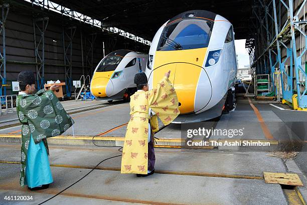 Shinto priests undergo a purification to Hitachi's Class 800 series trains before shipping at Hitachi's Kasado Works on Janaury 7, 2015 in Kudamatsu,...