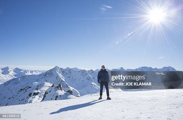 British actor Daniel Craig poses with Tyrolean Alps in the background during a photo call of the new James Bond film 'SPECTRE' in Austrian ski resort...