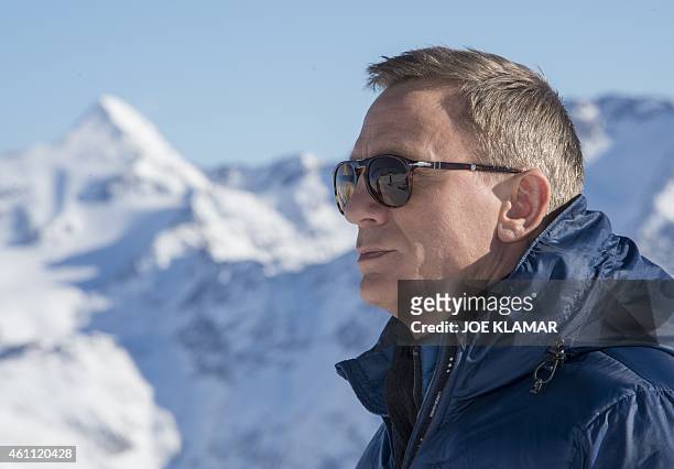 British actor Daniel Craig poses for pictures backgrounded by Tyrolean Alps during the photo call of new James Bond 007 film 'SPECTRE' in the...