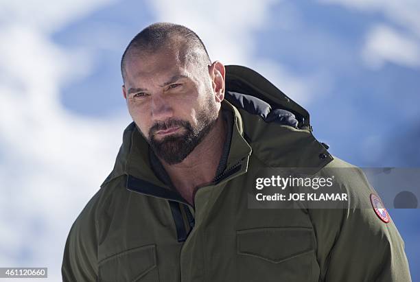 Actor Dave Bautista poses with Tyrolean Alps in the background during a photo call of the new James Bond film 'SPECTRE' in Austrian ski resort of...