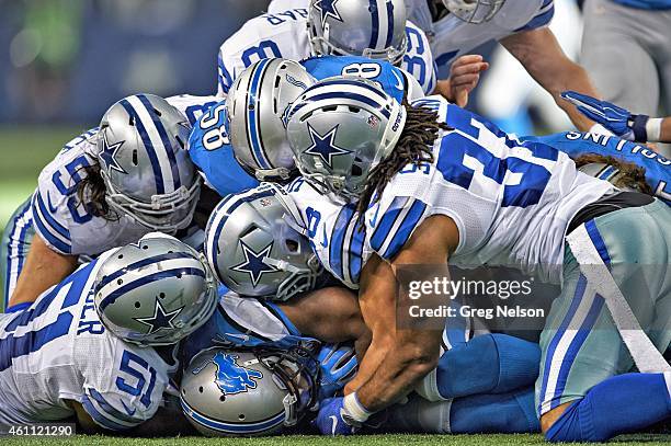 Playoffs: Dallas Cowboys defense Kyle Wilber , Cameron Lawrence , Jeff Heath , and C.J. Spillman in action, pileup tackle vs Detroit Lions Jeremy...