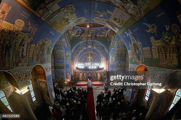 The congregation of Serbian Orthodox Christians celebrate the Nativity of Christ liturgy at Lazarica church in Bournville on January 7, 2015 in...