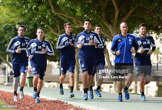 Christian Fuchs, Roman NEustaedter, Kaan Ayhan, Sead Kolasinac and Adam Szalai of Schalke 04 run next to a training session at day 3 of the Bayern...