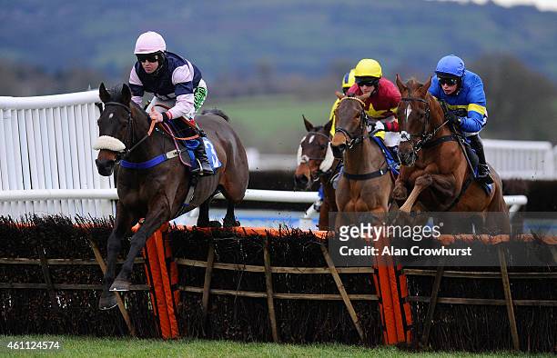 Robert Dunne riding Brandon Hill on their way to winning The 1871 Handicap Hurdle Race at Ludlow racecourse on January 07, 2015 in Ludlow, England.