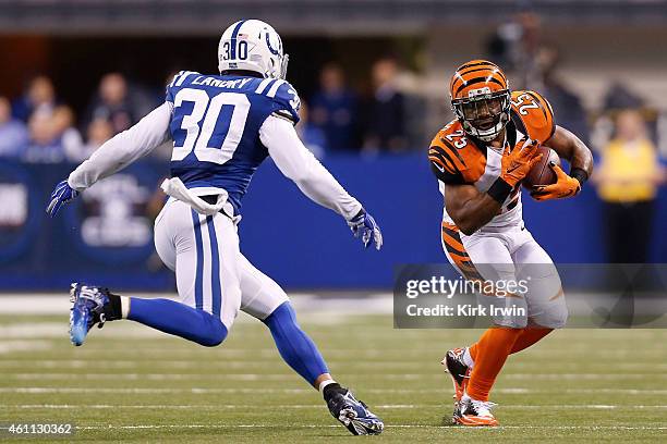 LaRon Landry of the Indianapolis Colts attempts to tackle Giovani Bernard of the Cincinnati Bengals during the game on January 4, 2015 at Lucas Oil...