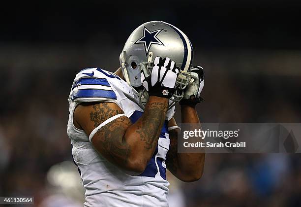 Anthony Spencer of the Dallas Cowboys reacts after missing an interception during a NFC Wild Card Playoff game against the Detroit Lions at AT&T...