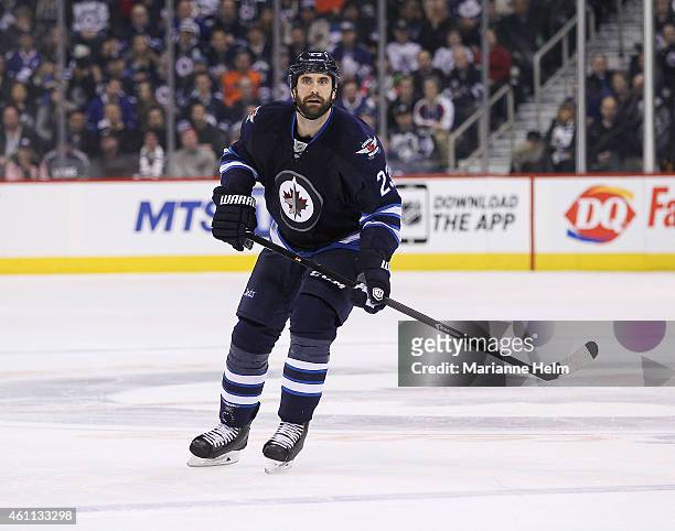 Jay Harrison of the Winnipeg Jets skates down the ice in second period action in an NHL game against the Toronto Maple Leafs at the MTS Centre on...