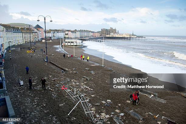 General view of the damaged promenade on January 7, 2014 in Aberystwyth, United Kingdom. A major cleanup operation has started today in the town...