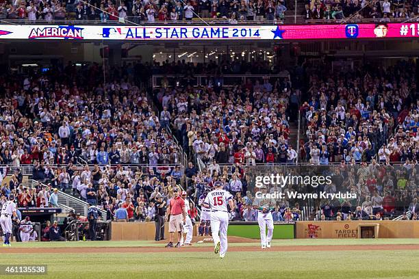 American League All-Star Glen Perkins of the Minnesota Twins jogs to the mound in the 9th inning as Yoenis Cespedes of the Oakland Athletics looks on...