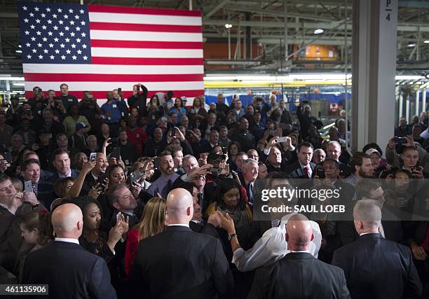 President Barack Obama greets workers after speaking about the automotive manufacturing industry at the Ford Michigan Assembly Plant in Wayne,...