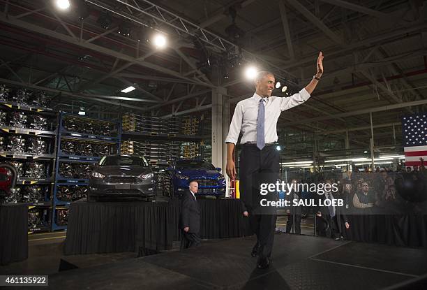 President Barack Obama waves after speaking about the automotive manufacturing industry at the Ford Michigan Assembly Plant in Wayne, Michigan,...