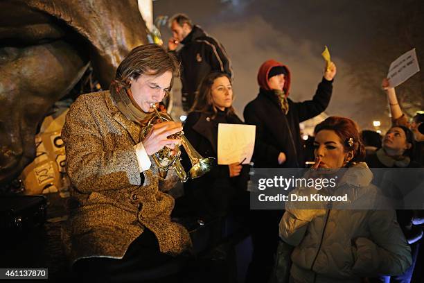 People hold a vigil at the Place de la Republique for victims of the terrorist attack, on January 7, 2015 in Paris, France. Twelve people were...