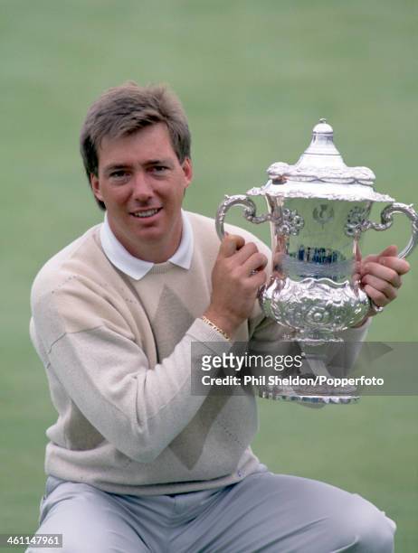 Barry Lane of Great Britain holds the trophy after winning the Scottish Open Golf Championship held on the King's Course at the Gleneagles Golf Club...