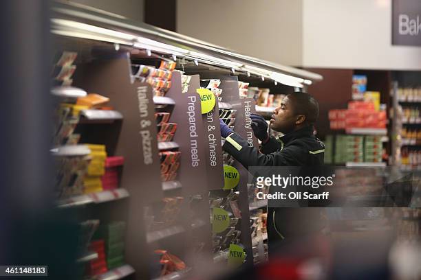 An employee restocks the shelves in a 'Simply Food' branch of Marks & Spencer on January 7, 2014 in London, England. The food and clothing retailer,...