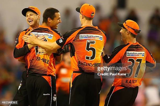 Adam Voges, Nathan Coulter-Nile, Jason Behrendorff and Simon Katich of the Scorchers celebrate the dismissal of Owais Shah of the Hurricanes during...