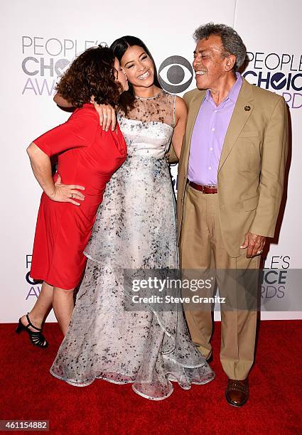 Magali Rodriguez, actress Gina Rodriguez and boxing referee Genaro Rodriguez pose in the press room at the 41st Annual People's Choice Awards at...