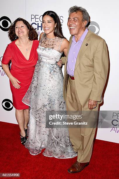 Magali Rodriguez, actress Gina Rodriguez and boxing referee Genaro Rodriguez pose in the press room at the 41st Annual People's Choice Awards at...