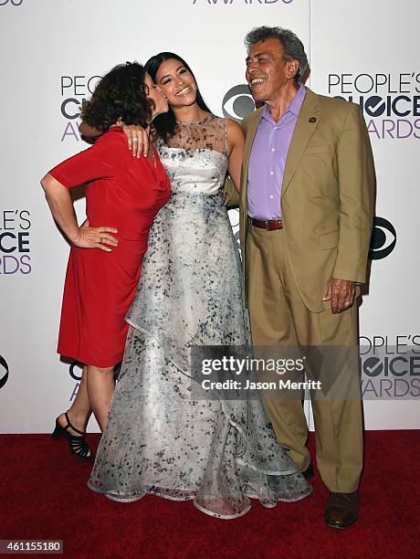 Magali Rodriguez, actress Gina Rodriguez and boxing referee Genaro Rodriguez pose in the press room at The 41st Annual People's Choice Awards at...