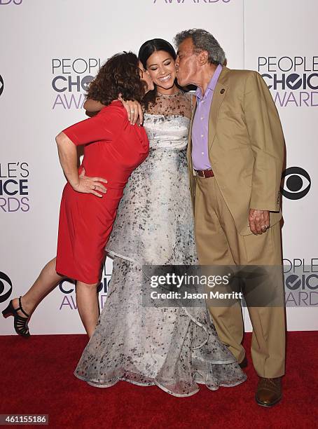 Magali Rodriguez, actress Gina Rodriguez and boxing referee Genaro Rodriguez pose in the press room at The 41st Annual People's Choice Awards at...