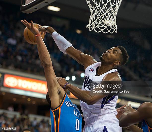 Sacramento Kings forward Jason Thompson blocks the shot attempted by Oklahoma City Thunder guard Russell Westbrook during the first quarter on...