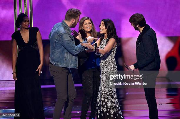 Musicians Charles Kelley, Hilary Scott and Dave Haywood of Lady Antebellum accept the award for Favorite Country Group onstage with actress Lisa...