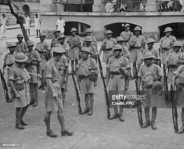 Colonial Indian soldiers in military formation during World War Two, occupied Hong Kong, circa 1941.