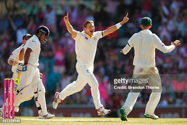 Shane Watson of Australia celebrates after claiming the wicket of Suresh Raina of India during day three of the Fourth Test match between Australia...