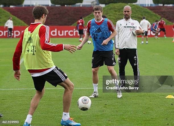 Pep Guardiola, coach of Bayern Muenchen directs the practice session, here with Toni Kroos and Thomas Muller, on day 2 of Bayern Muenchen Training...