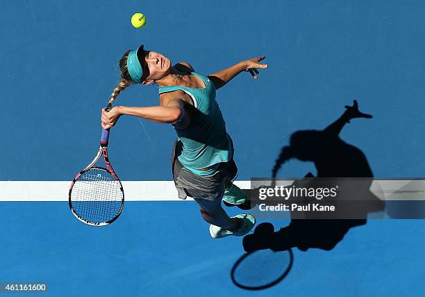 Eugenie Bouchard of Canada serves in the mixed doubles match partnered with Vasek Pospisil against Fabio Fognini and Flavia Pennetta of Italy during...