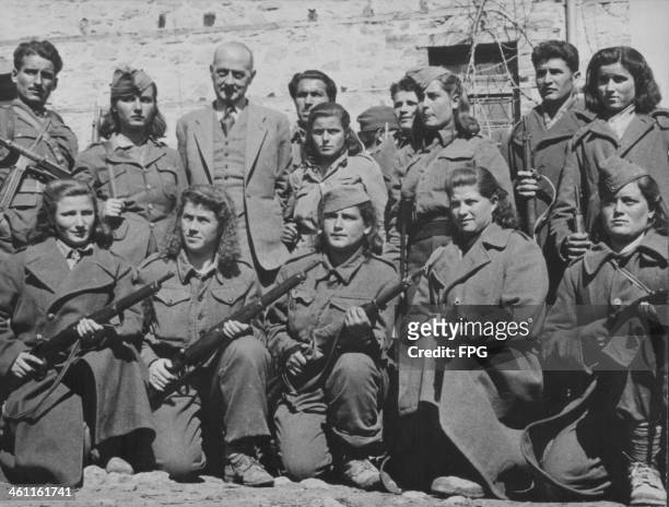 Greek women aiding the war effort during World War Two, with Lieutenant Maurice Delvoie of Belgium, Greece, circa 1939-1945.