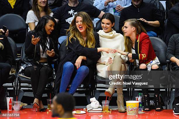 Malika Haqq, Khloe Kardashian, Kendall Jenner and Cara Delevingne attend a basketball game between the Los Angeles Lakers and the Los Angeles...