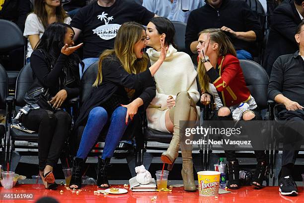 Malika Haqq, Khloe Kardashian, Kendall Jenner and Cara Delevingne attend a basketball game between the Los Angeles Lakers and the Los Angeles...