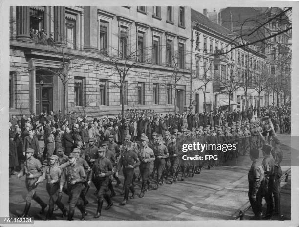 Nationalist Socialist parade passing the Ministry of the Interior prior to World War Two, Germany, circa 1935-1940.