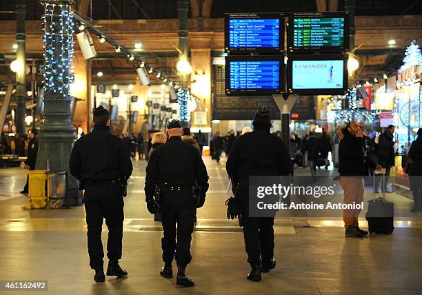 Police officers patrol the Gare du Nord railway station on January 8, 2015 in Paris, France. France's Vigipirate terrorist security plan is at it's...