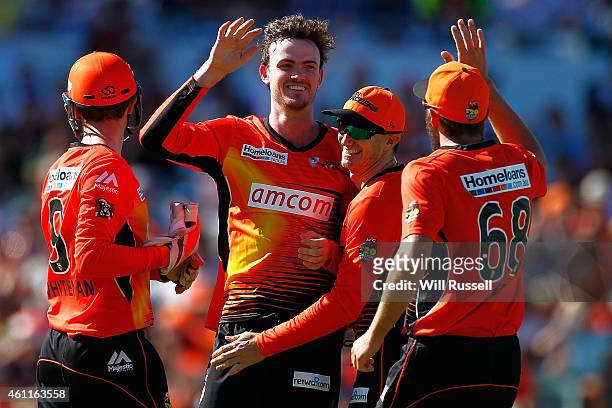 Ashton Turner of the Scorchers celebrates after taking the wicket of Peter Forrest of the Heat during the Big Bash League match between the Perth...