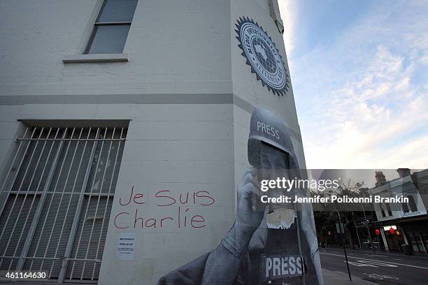 Members of the Media Entertainment and Arts Alliance remember victims of the Paris Massacre by creating a memorial wall of cartoons at Chalmers...