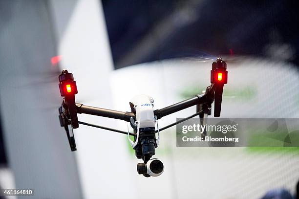 Inspire 1 drone, manufactured by SZ DJI Technology Co., flies during the 2015 Consumer Electronics Show in Las Vegas, Nevada, U.S., on Wednesday,...