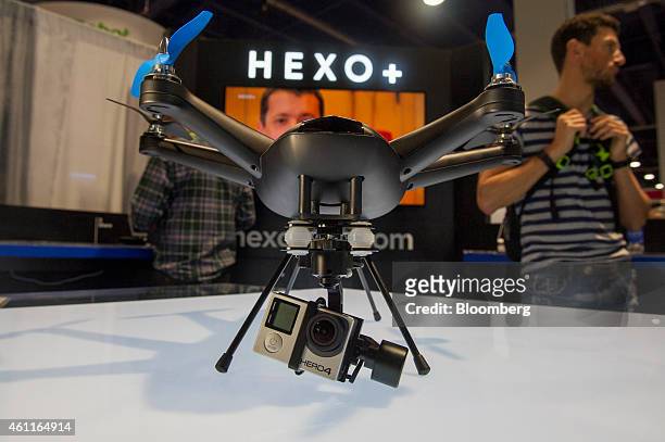 GoPro Inc. Hero 4 is fitted to a Hexo+ drone, manufactured by Squadrone System Inc., on display during the 2015 Consumer Electronics Show in Las...